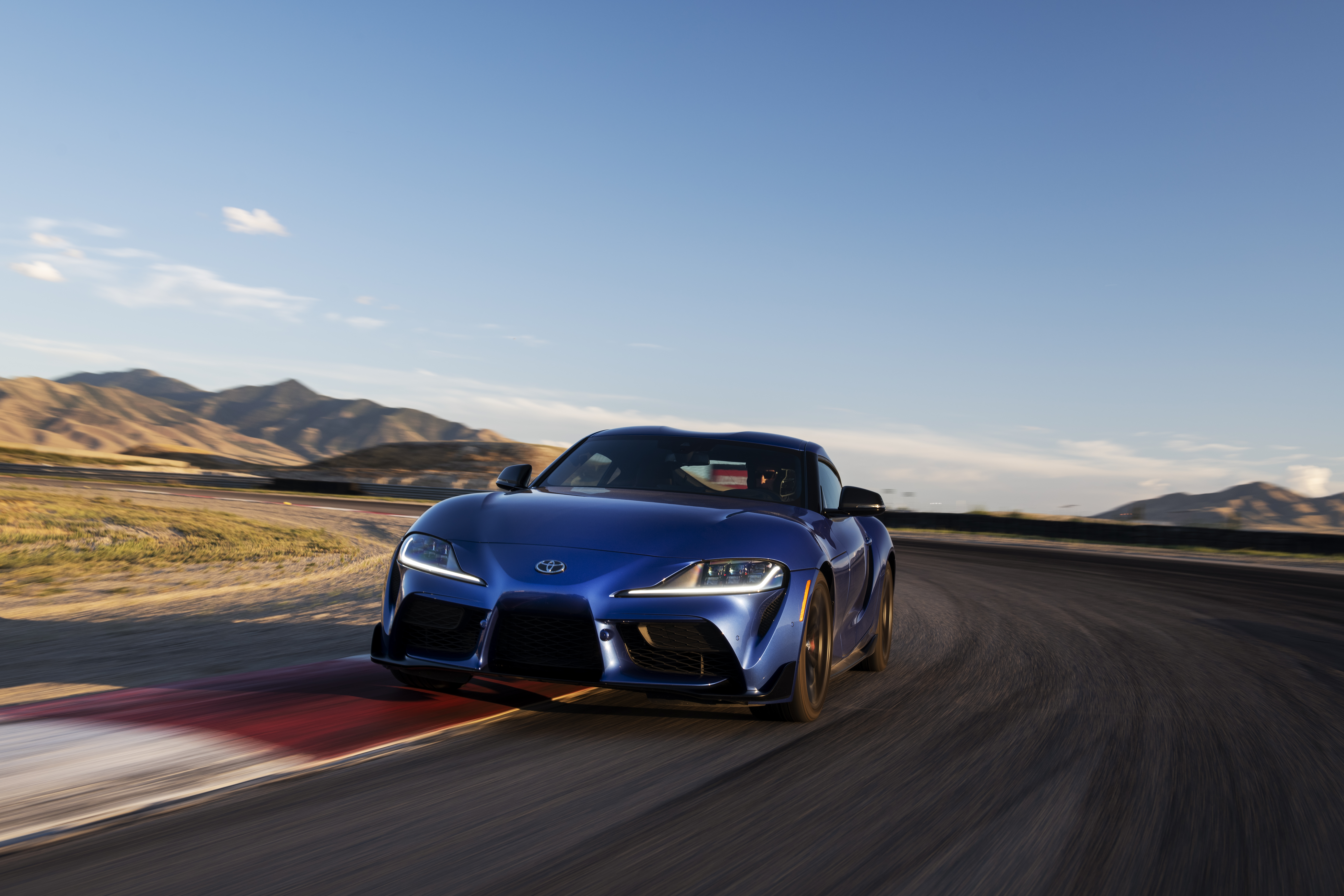 Fast cars daily Toyota Supra GR Manual Stratoshpre Blue cornering